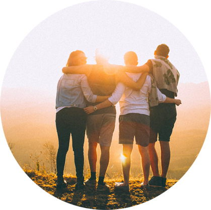 Group of People Hugging seeing the Sunset